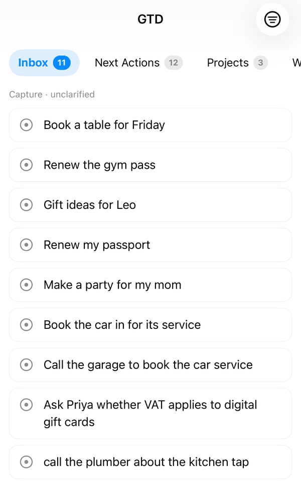 The GTD Brain iPhone app on the Inbox tab, showing 11 unclarified cards such as Book a table for Friday and call the plumber about the kitchen tap